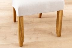 Design Stuhl CASA beige Leinen Massivholzbeine mit Zierknöpfen und Nackenrolle