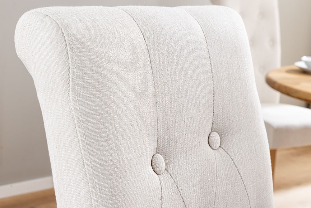 Design Stuhl CASA beige Leinen Massivholzbeine mit Zierknöpfen und Nackenrolle