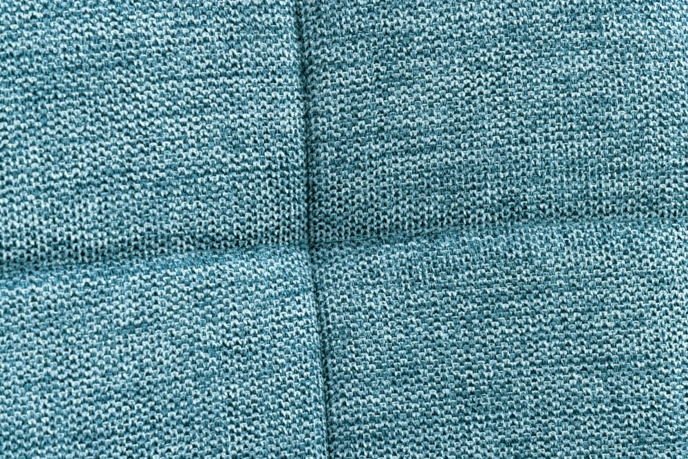 Moderner Hocker SCANDINAVIA blau Strukturstoff Metallbeine Fußhocker