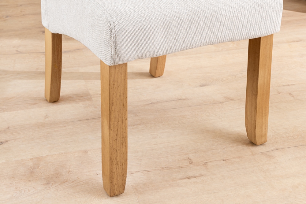 Design Stuhl CASA beige Strukturstoff Massivholzbeine mit Zierknöpfen und Nackenrolle