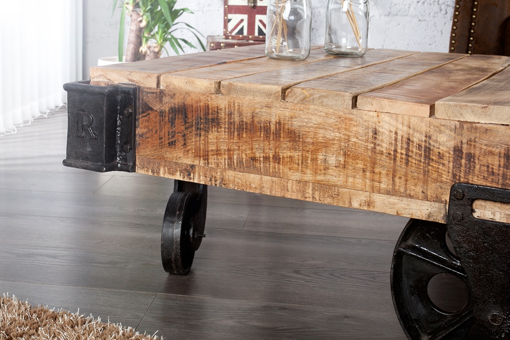 Massiver Design Couchtisch RAILWAY 110cm Mangoholz mit 4 Rädern