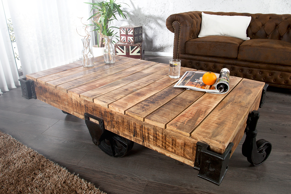 Massiver Design Couchtisch RAILWAY 110cm Mangoholz mit 4 Rädern